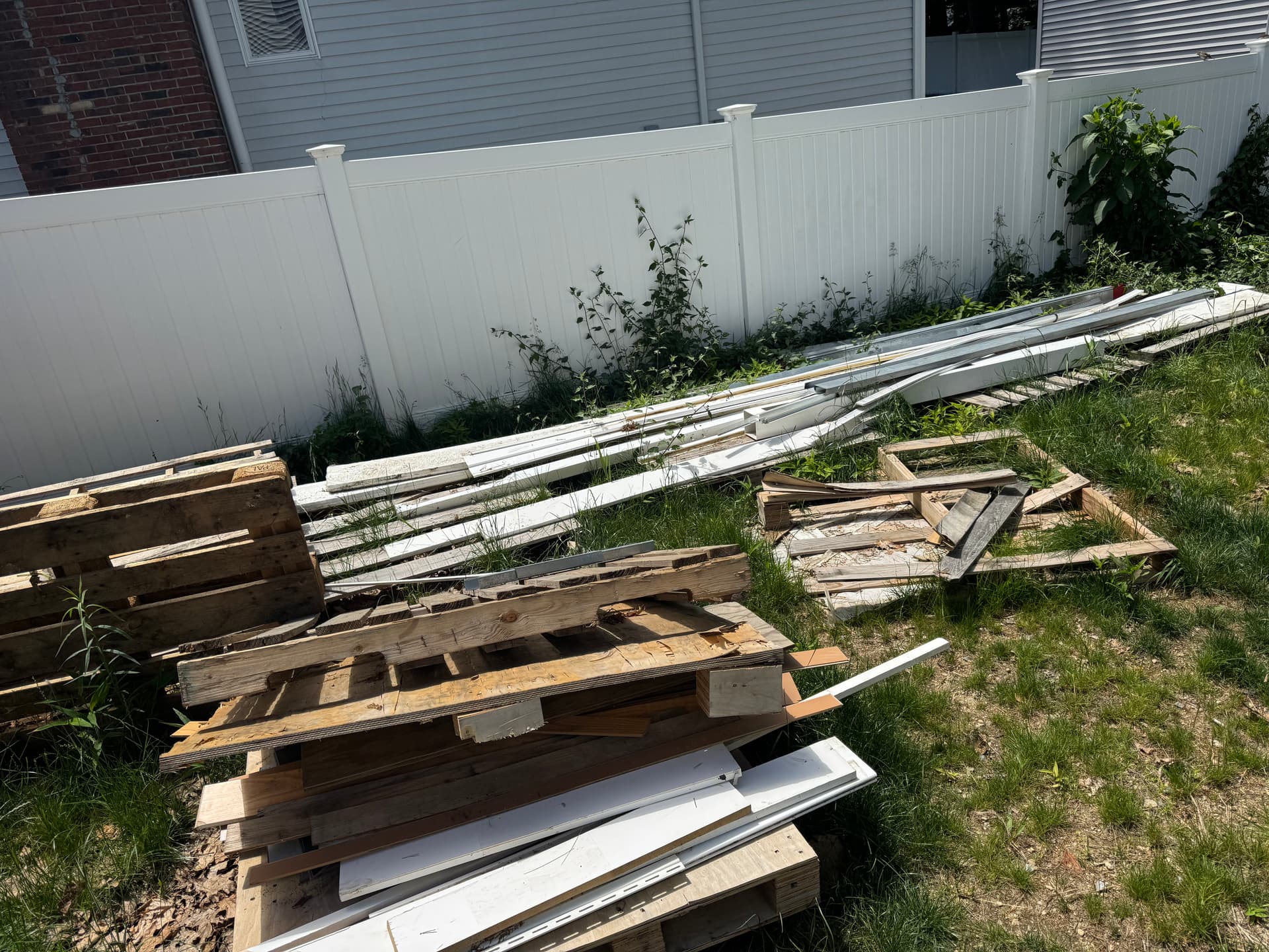 Gallery photos for Pelham NH Backyard Construction Debris Cleared Out: Image #1