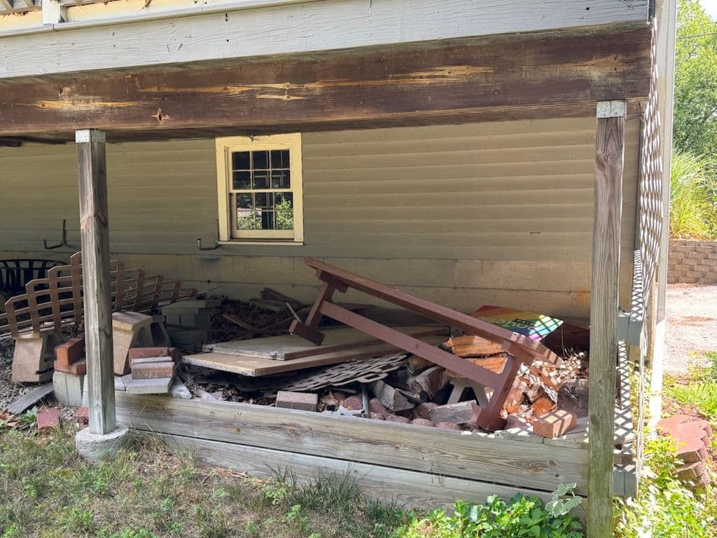 Junk Removal Transformation Underneath Deck in Nashua image